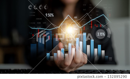 Business Professional Holding Light Bulb with Graphs and Charts in Background Representing Ideas, Innovation, and Growth in Financial Market Analysis Scalp Business Professional Holding Light Bulb with Graphs and Charts in Background Representing Ideas, Innovation, and Growth in Financial Market Analysis Scalp 132895290