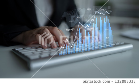 Business professional analyzes data and visualizes financial performance with modern keyboard and digital graph in contemporary office setting Scalp 132895335