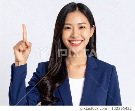 A young woman posing with her index finger up A young woman posing with her index finger up 132895422