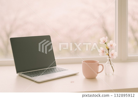 Laptop and cherry blossoms 132895912