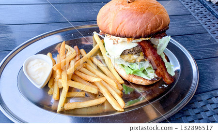 A hearty deluxe burger A hearty deluxe burger 132896517