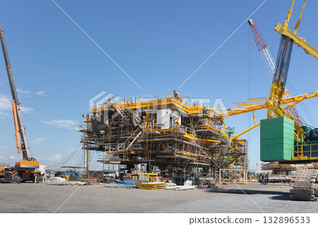 Offshore oil rig under constructionwith sky background. Offshore oil rig under constructionwith sky background. 132896533
