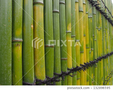 New bamboo fence tied with black string New bamboo fence tied with black string 132896595