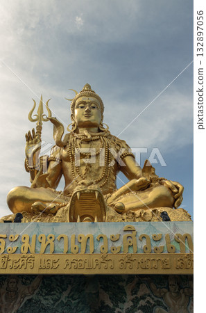 a large golden statue of Lord Shiva is a major deity in Hinduism. a large golden statue of Lord Shiva is a major deity in Hinduism. 132897056
