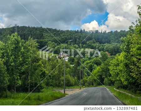 Mountain Horizons Road Through Majestic Peaks 132897481
