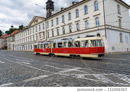 Vintage Tram on Cobblestone Street in Prague, Czech Republic A Nostalgic European Scene Vintage Tram on Cobblestone Street in Prague, Czech Republic A Nostalgic European Scene 132898367