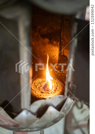 Burning candle flame, in the Buddhist temple 132899042