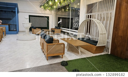 This is sofa chair as the interior in the living room area 132899182