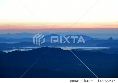 Myanmar, Kyaikhtiyo, mountains before dawn, morning mist Myanmar, Kyaikhtiyo, mountains before dawn, morning mist 132899637