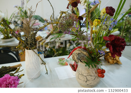 Colorful floral arrangements displayed at a local craft fair showcasing creativity and natural beauty from a vibrant community of artists and enthusiasts 132900433