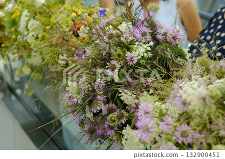Bright wildflowers arranged beautifully at a spring market showcasing local flora and nature's colors during a sunny afternoon 132900451