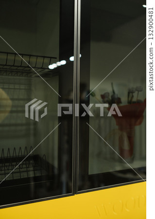 Building an efficient display case with glass doors in a kitchen environment showcasing storage and organization techniques Building an efficient display case with glass doors in a kitchen environment showcasing storage and organization techniques 132900481