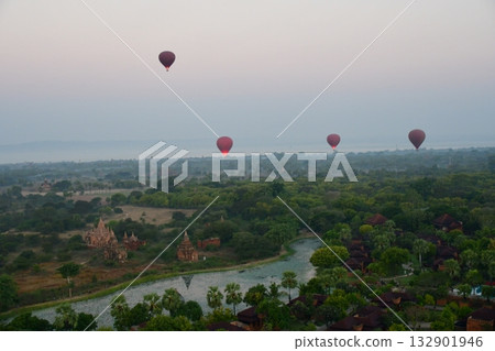 Myanmar, Bagan, view from Bagan Viewing Tower, pagodas in the morning mist, hot air balloon Myanmar, Bagan, view from Bagan Viewing Tower, pagodas in the morning mist, hot air balloon 132901946