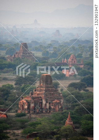 View of the pagodas in the morning mist from the Bagan Viewing Tower, Bagan, Myanmar View of the pagodas in the morning mist from the Bagan Viewing Tower, Bagan, Myanmar 132901947