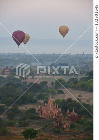 Myanmar, Bagan, view from Bagan Viewing Tower, pagodas in the morning mist, hot air balloon Myanmar, Bagan, view from Bagan Viewing Tower, pagodas in the morning mist, hot air balloon 132901948