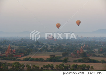 Myanmar, Bagan, view from Bagan Viewing Tower, pagodas in the morning mist, hot air balloon Myanmar, Bagan, view from Bagan Viewing Tower, pagodas in the morning mist, hot air balloon 132901953