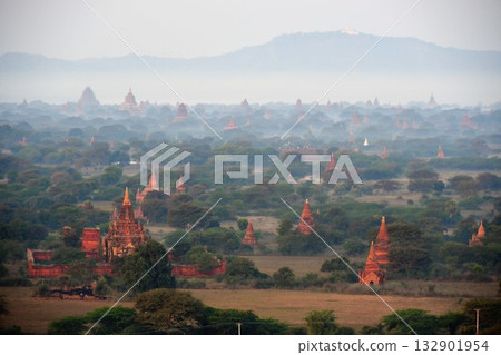 View of the pagodas in the morning mist from the Bagan Viewing Tower, Bagan, Myanmar View of the pagodas in the morning mist from the Bagan Viewing Tower, Bagan, Myanmar 132901954