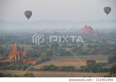 Myanmar, Bagan, view from Bagan Viewing Tower, pagodas in the morning mist, hot air balloon Myanmar, Bagan, view from Bagan Viewing Tower, pagodas in the morning mist, hot air balloon 132901960