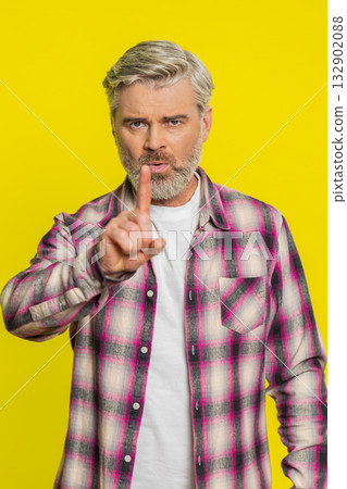 Mature man shaking head, waving finger, expressing no, negative gesture refusal disagreement concept Mature man shaking head, waving finger, expressing no, negative gesture refusal disagreement concept 132902088