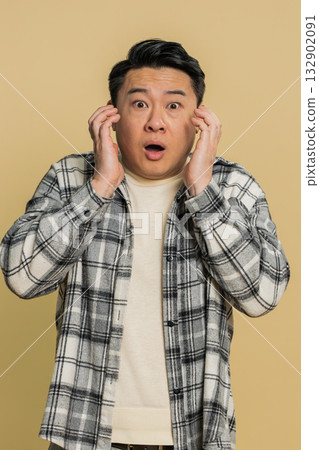 Scared fearful depressed Asian man suffering phobia, anxiety disorder, expresses fear, stress panic Scared fearful depressed Asian man suffering phobia, anxiety disorder, expresses fear, stress panic 132902091