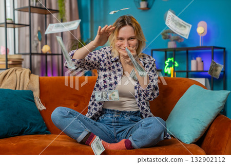 Happy rich woman showing wasting, throwing money around win casino lottery game jackpot celebrate Happy rich woman showing wasting, throwing money around win casino lottery game jackpot celebrate 132902112