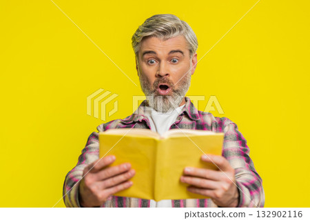 Mature man opening book, amazed face, sudden revelation, instant interest surprising story vibe 132902116