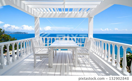 [AI-generated image] A white balcony overlooking the cobalt blue sea 132902848