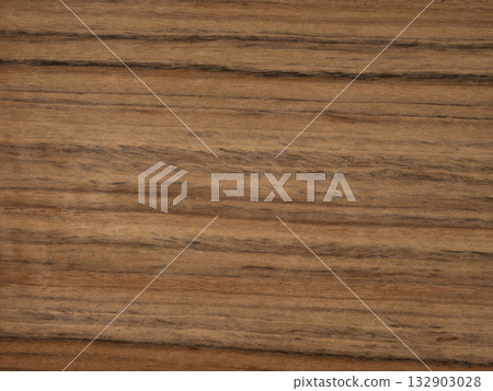 Striated Daniela veneer showcasing natural wood streaks and warm hues Striated Daniela veneer showcasing natural wood streaks and warm hues 132903028