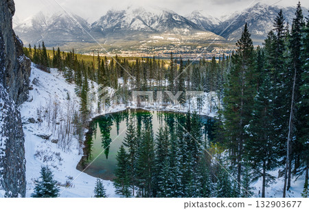 Panoramic view of Grassi Lakes in winter with reflections in the water. Alberta, Canada 132903677