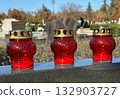 Candlelits on a tombstone in the public cemetery 132903727