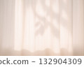 Shadow of a leaf reflected on the curtain 132904309