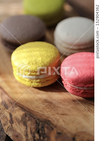 Colorful macarons on a wooden board Colorful macarons on a wooden board 132904362