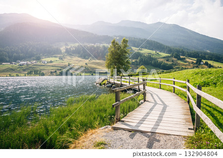 Great of the alpine Haidersee lake. Location San Valentino Alla Muta village, Italy alps, Europe. 132904804
