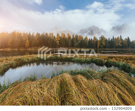 Great view of the foggy lake Antorno in National Park Tre Cime di Lavaredo. Great view of the foggy lake Antorno in National Park Tre Cime di Lavaredo. 132904809