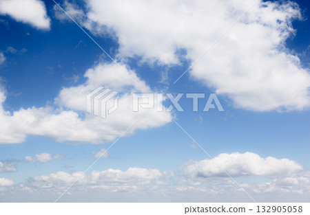 Fantastic view of the azure sky on a sunny day with fluffy clouds. 132905058