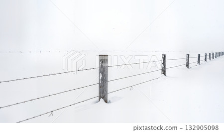 Minimalist Winter Fence Post in Deep Snow with Barbed Wire and Buried Split Rail Fencing Composition Minimalist Winter Fence Post in Deep Snow with Barbed Wire and Buried Split Rail Fencing Composition 132905098
