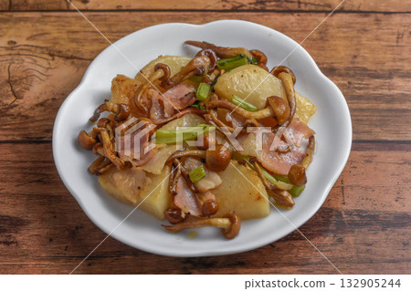 Stir-fried turnip and nameko mushrooms with butter Stir-fried turnip and nameko mushrooms with butter 132905244