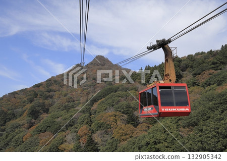 A red ropeway heading to the summit of Mount Tsukuba (Mount Nyotai) on a clear autumn day A red ropeway heading to the summit of Mount Tsukuba (Mount Nyotai) on a clear autumn day 132905342