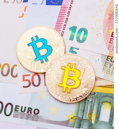 Golden bitcoins metallic coin over euro banknotes, future financial technology concept. 132906848