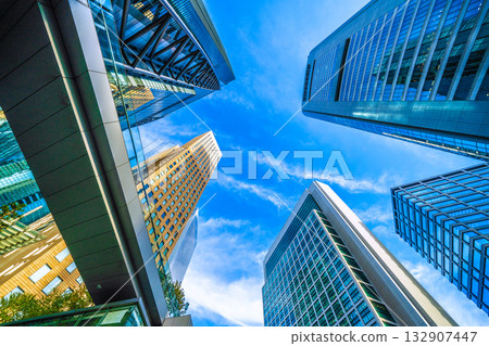 Tokyo cityscape, Japan, November 4th. Shiodome office district, with Nippon Television Tower and Kyodo News in view. Tokyo cityscape, Japan, November 4th. Shiodome office district, with Nippon Television Tower and Kyodo News in view. 132907447