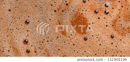 Macro texture of hot chocolate foam with bubbles on surface, close-up of creamy cocoa drink background, warm beverage detail, abstract brown liquid pattern for food design 132908196