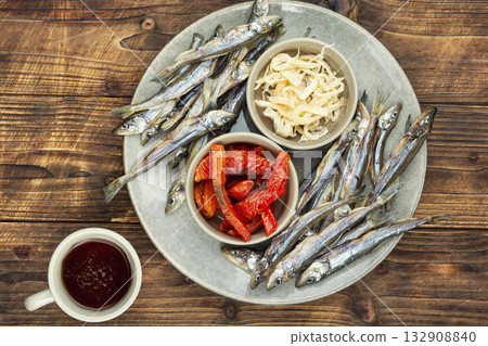Beer and assorted dried fish 132908840
