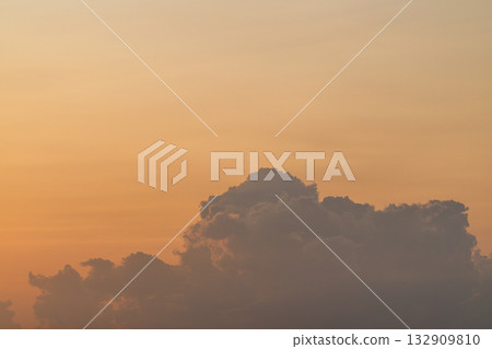 Experience a Serene Sunset adorned with Soft Clouds, offering a breathtaking visual showcase Experience a Serene Sunset adorned with Soft Clouds, offering a breathtaking visual showcase 132909810