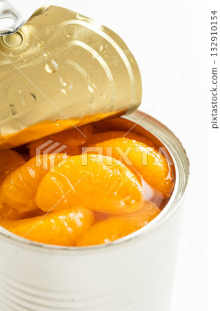 Canned mandarin oranges on a white background Canned mandarin oranges on a white background 132910154