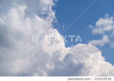 The sky is beautifully cloudy, filled with shades of blue as a vibrant background canvas The sky is beautifully cloudy, filled with shades of blue as a vibrant background canvas 132910536