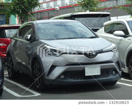 Passenger cars (Toyota C-HR) lined up in a parking lot Passenger cars (Toyota C-HR) lined up in a parking lot 132910623