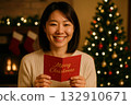A woman with a Christmas gift 132910671