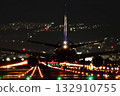 Silhouette of a passenger plane standing on a runway at night Silhouette of a passenger plane standing on a runway at night 132910755