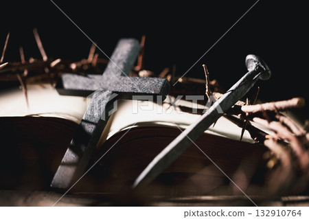 Crucifixion of Jesus Christ, nail-pierced hands, crown of thorns, cross, symbol of Christianity, representing holy sacrifice, passion, faith central to Easter celebration, religious tradition. Crucifixion of Jesus Christ, nail-pierced hands, crown of thorns, cross, symbol of Christianity, representing holy sacrifice, passion, faith central to Easter celebration, religious tradition. 132910764