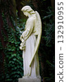 white angel sculpture in a cemetery 132910955